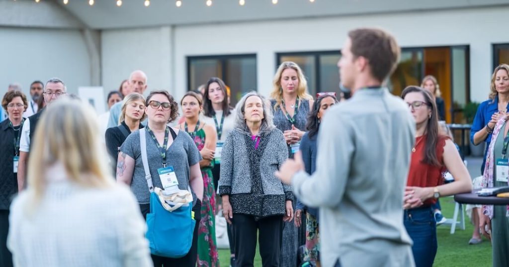 IMMH-2025-day-1_flamingo-lawn_a-whole-person-welcome-_attendee_audience_004